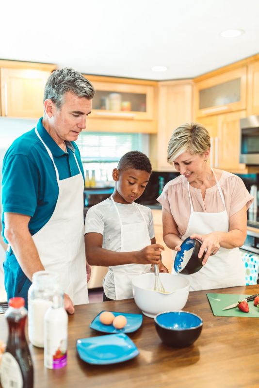 A family baking together in the kitchen